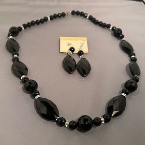 Black bead necklace and earrings.